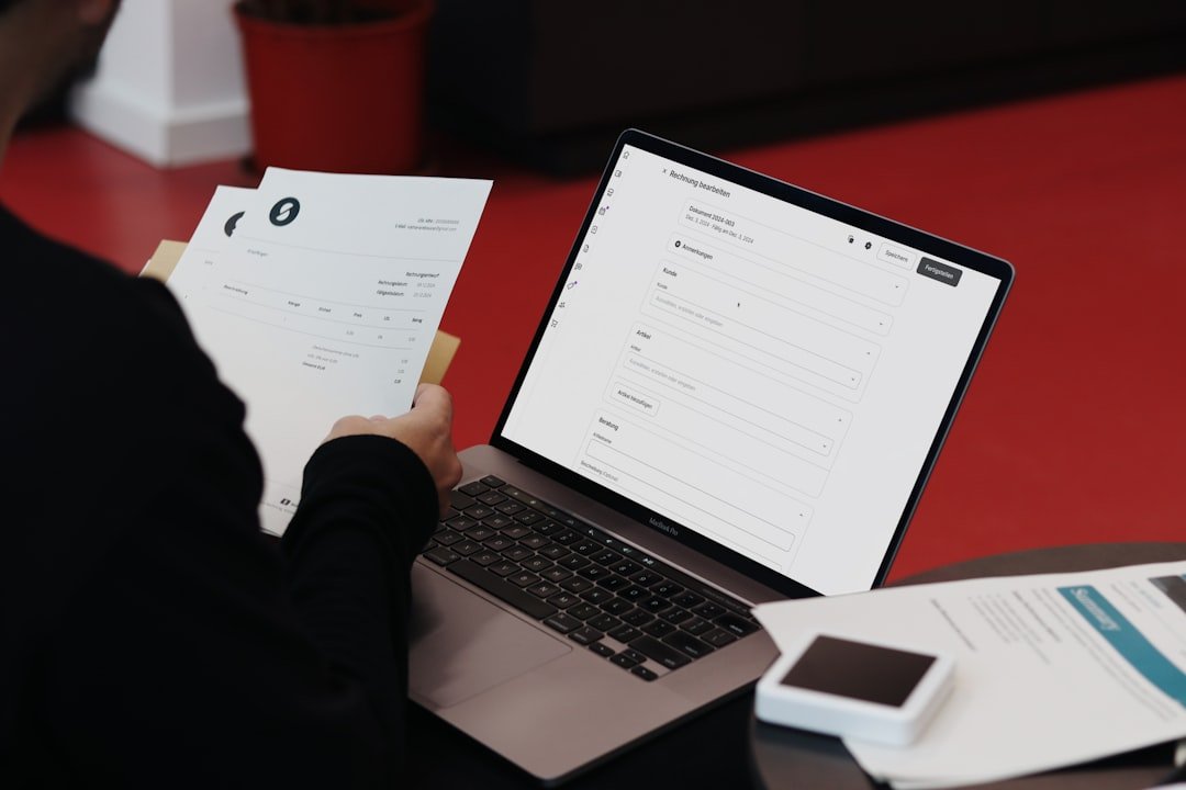 A person balancing traditional documents with an online invoice system. SumUp combines convenience and efficiency for businesses.